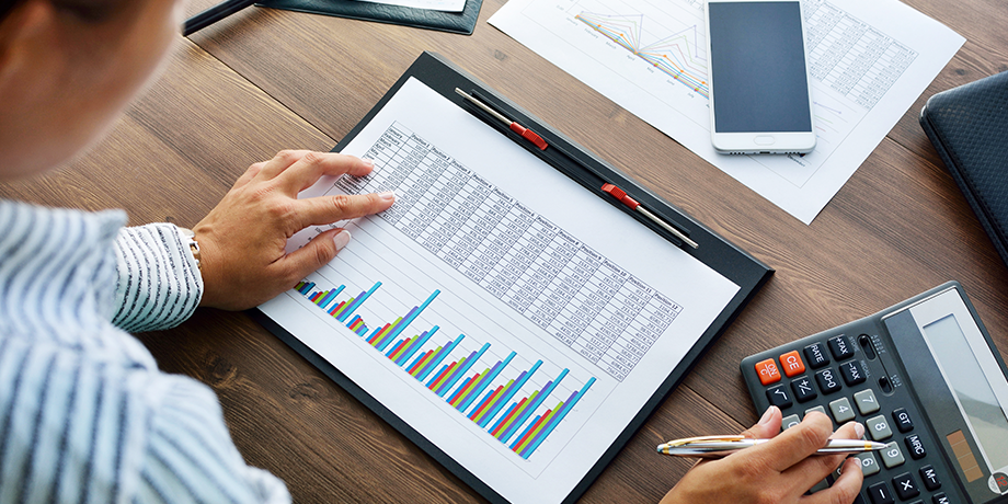 Businessman reviews his Company's statistics from MM Recycling Waste Report